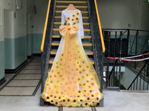 Yellow Sunflower Dress stood infront of stair case at Shepton Mallet Prison